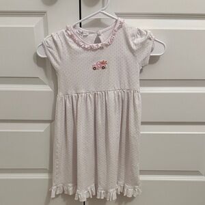 Magnolia Baby White and Pink Ruffle Dress with truck carrying pumpkins